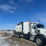 Jagen clean hydrovac truck after washing down in a field