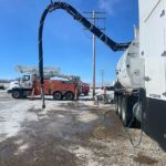 Jagen Hydrovac starting to soil trench by powerlines